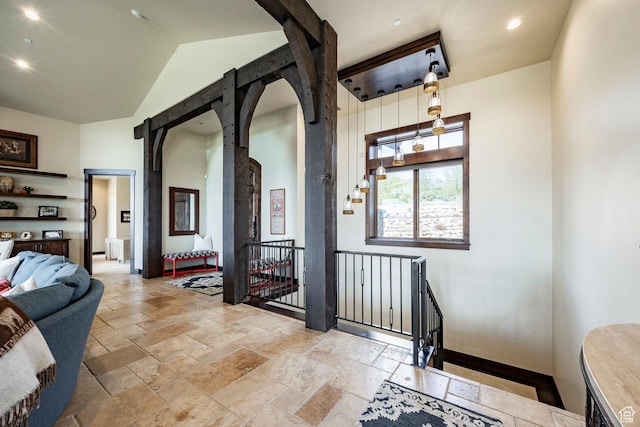 787 N Red Ledges Blvd, Heber City, UT 84032 - hall with an upstairs landing, recessed lighting, stone tile floors, arched walkways, and baseboards