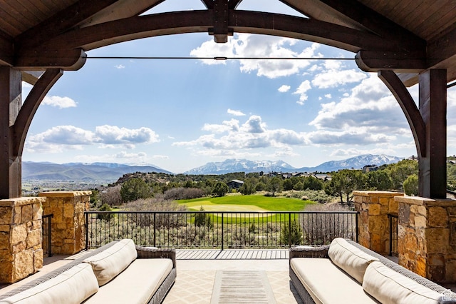 view of patio / terrace with outdoor lounge area, a mountain view, and a balcony