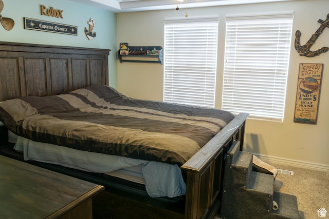 bedroom featuring baseboards and carpet flooring