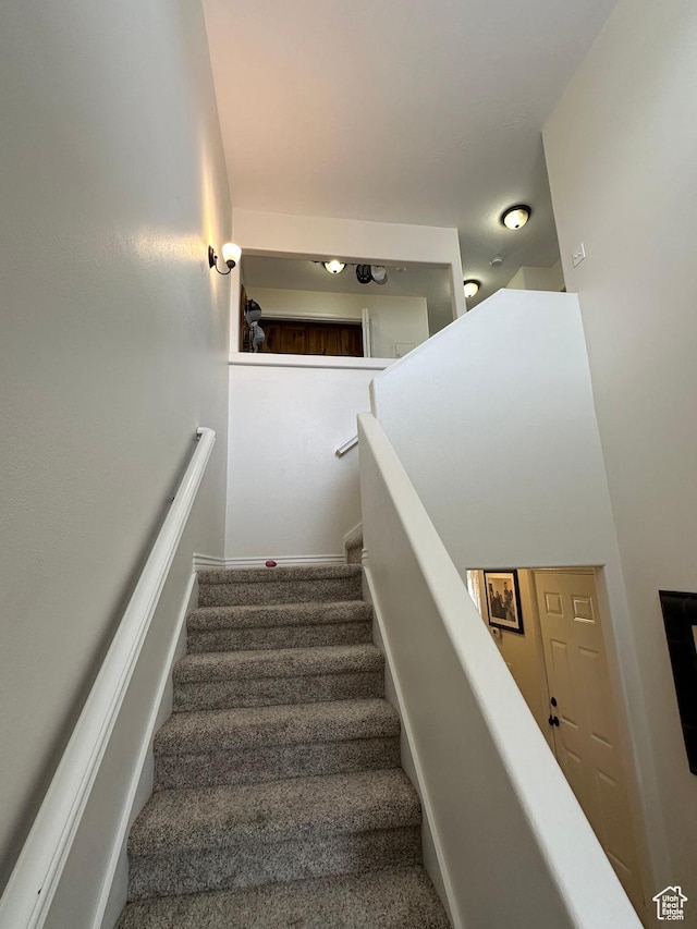 stairway with carpet floors
