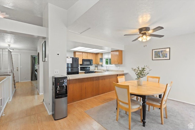 3262 W 6920 S, West Jordan, UT 84084 - dining area with light wood-type flooring, baseboards, and a ceiling fan