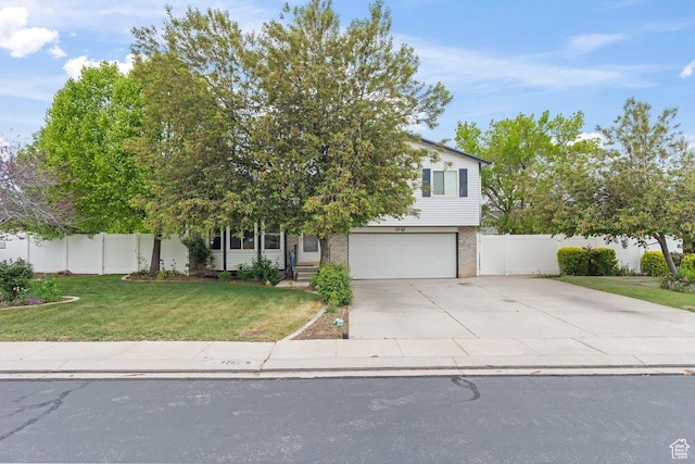 3262 W 6920 S, West Jordan, UT 84084 - obstructed view of property featuring concrete driveway, a front lawn, an attached garage, and fence