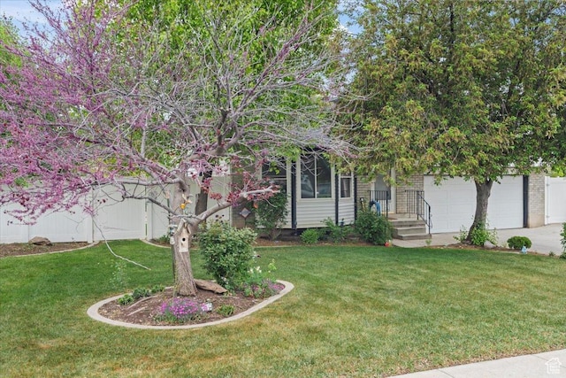 3262 W 6920 S, West Jordan, UT 84084 - view of yard featuring concrete driveway and a garage