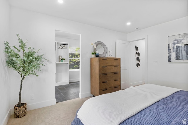 bedroom with baseboards, recessed lighting, and carpet