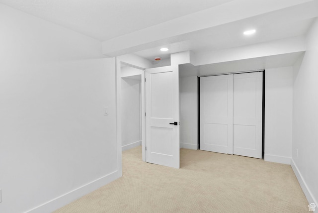 unfurnished bedroom with carpet floors, baseboards, and recessed lighting