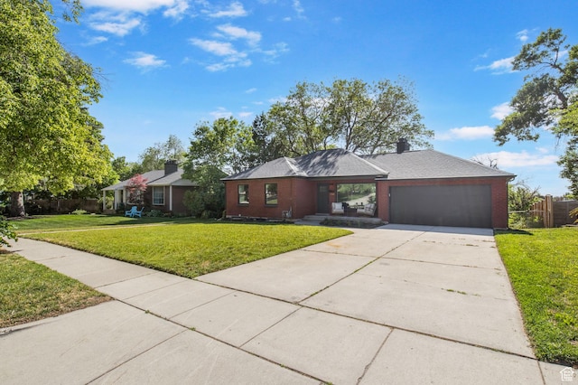 1940 S 2500 E, Salt Lake City, UT 84108 - view of front of house with concrete driveway, a garage, and brick siding