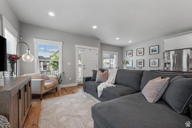 4455 W Glendon Dr, Lehi, UT 84043 - living area with baseboards, light wood finished floors, and recessed lighting