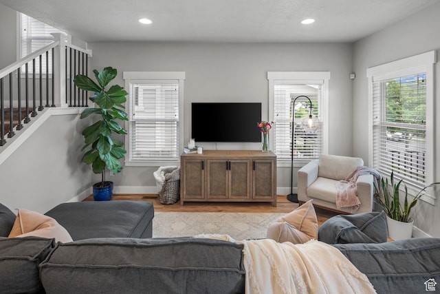 4455 W Glendon Dr, Lehi, UT 84043 - living room with light wood-style floors, stairway, baseboards, and recessed lighting