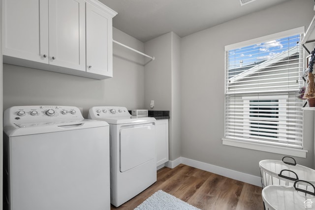 4455 W Glendon Dr, Lehi, UT 84043 - clothes washing area with wood finished floors, cabinet space, baseboards, and washer and dryer
