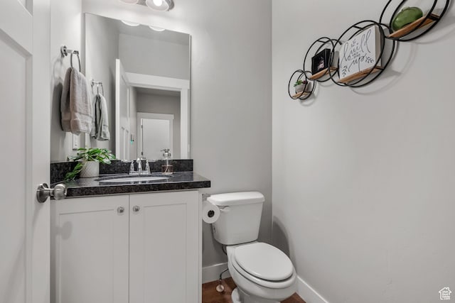 4455 W Glendon Dr, Lehi, UT 84043 - bathroom featuring toilet, baseboards, and vanity