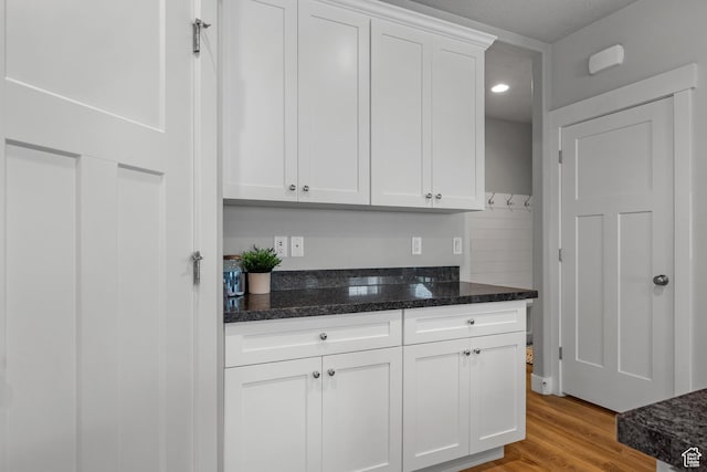 4455 W Glendon Dr, Lehi, UT 84043 - kitchen featuring white cabinetry, recessed lighting, dark stone counters, and light wood-type flooring