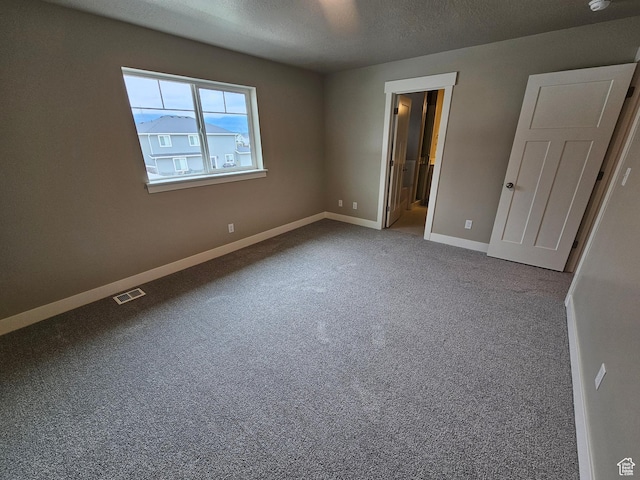 518 N 1400 W Lot 26, Springville, UT 84663 - unfurnished bedroom with a textured ceiling, carpet, baseboards, ensuite bathroom, and visible vents