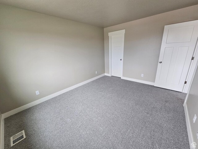 518 N 1400 W Lot 26, Springville, UT 84663 - spare room featuring visible vents, baseboards, and dark colored carpet