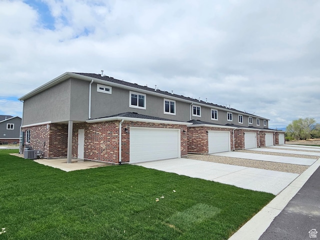 518 N 1400 W Lot 26, Springville, UT 84663 - view of property with concrete driveway, a garage, stucco siding, a front yard, and cooling unit