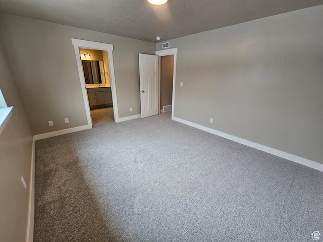 518 N 1400 W Lot 26, Springville, UT 84663 - unfurnished bedroom with carpet floors, a textured ceiling, ensuite bathroom, baseboards, and visible vents