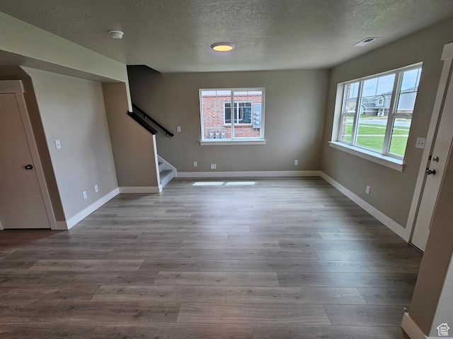 518 N 1400 W Lot 26, Springville, UT 84663 - unfurnished living room featuring stairway, visible vents, a textured ceiling, and wood finished floors