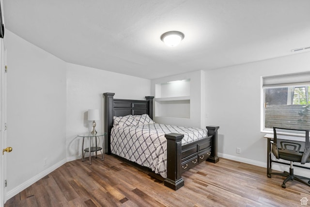 3470 W Maynard Ct, Riverton, UT 84065 - bedroom with visible vents, wood finished floors, and baseboards