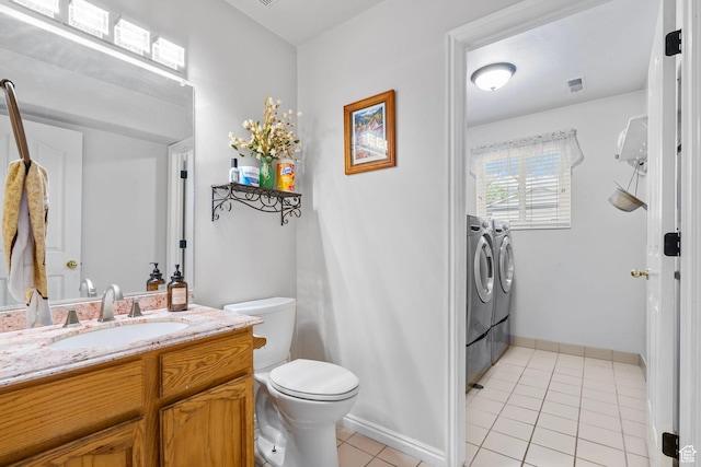 3470 W Maynard Ct, Riverton, UT 84065 - bathroom featuring washer and dryer, toilet, visible vents, tile patterned flooring, and vanity