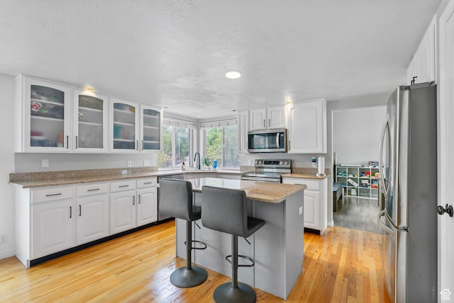 3470 W Maynard Ct, Riverton, UT 84065 - kitchen with white cabinetry, appliances with stainless steel finishes, and a sink