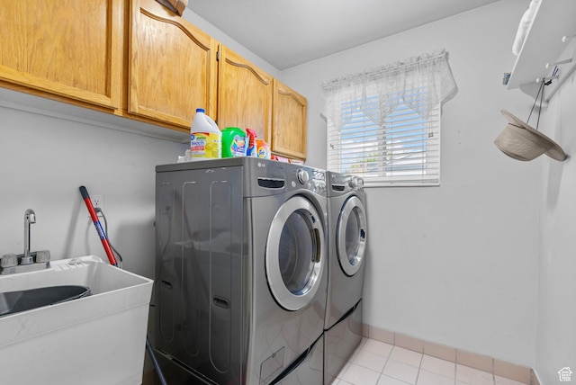3470 W Maynard Ct, Riverton, UT 84065 - laundry area featuring independent washer and dryer, light tile patterned floors, baseboards, a sink, and cabinet space