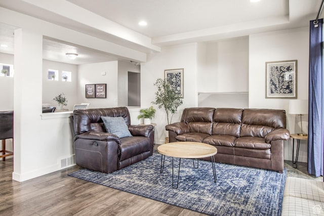 living room with baseboards, recessed lighting, visible vents, and wood finished floors