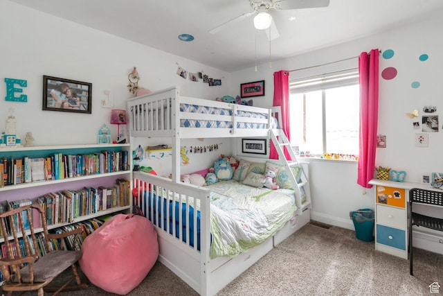 carpeted bedroom with baseboards and a ceiling fan