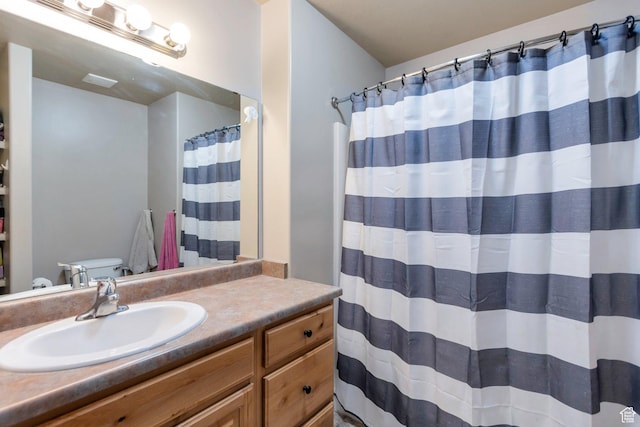 full bathroom with a shower with curtain and vanity