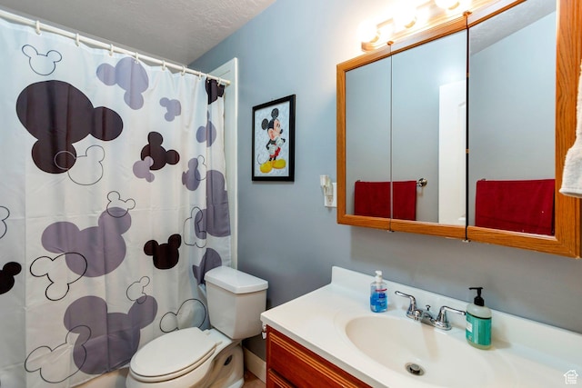 bathroom with toilet, vanity, shower / bath combination with curtain, and a textured ceiling