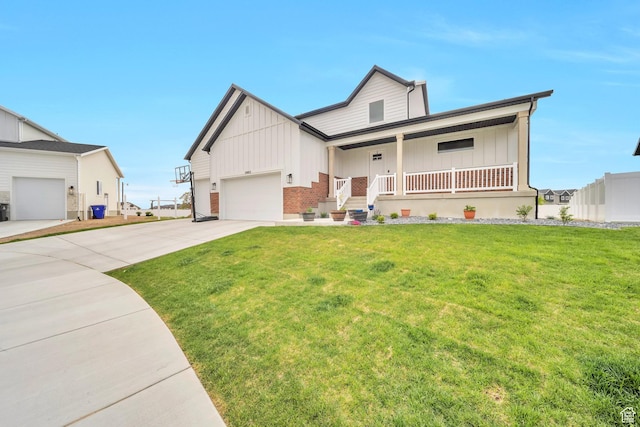 2882 S Allison Way W, Syracuse, UT 84075 - view of front of home with board and batten siding, concrete driveway, a porch, a front yard, and an attached garage