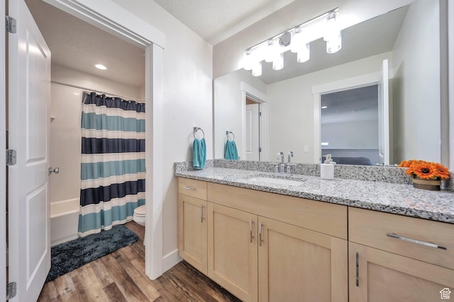 2882 S Allison Way W, Syracuse, UT 84075 - bathroom with wood finished floors, vanity, toilet, shower / bath combo, and baseboards