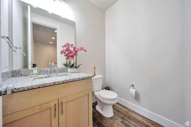 2882 S Allison Way W, Syracuse, UT 84075 - bathroom with toilet, wood finished floors, vanity, and baseboards