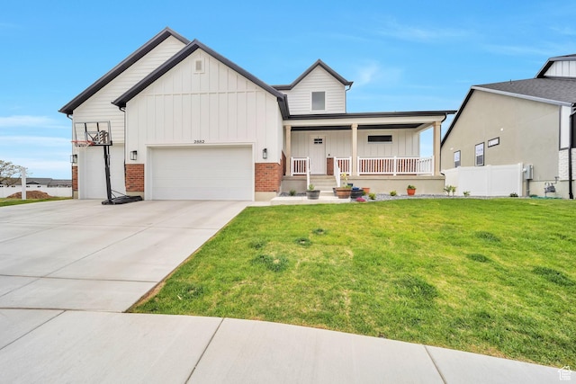 2882 S Allison Way W, Syracuse, UT 84075 - view of front of home with board and batten siding, a porch, a garage, driveway, and brick siding