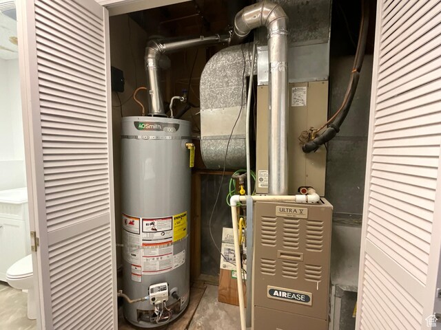 2610 S 8000 W, Magna, UT 84044 - utility room with water heater and heating unit