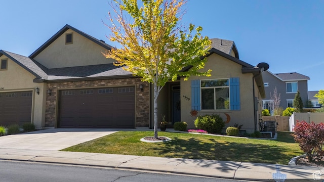 1559 W 430 N, Lindon, UT 84042 - view of front of home with fence, driveway, a garage, stucco siding, and a front yard