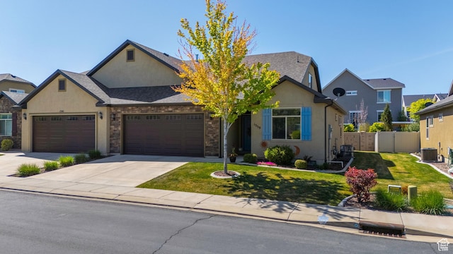 1559 W 430 N, Lindon, UT 84042 - view of front of house with a garage, stucco siding, fence, and a front yard