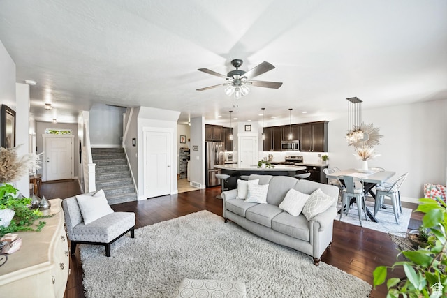 1559 W 430 N, Lindon, UT 84042 - living room featuring stairway, dark wood-style flooring, baseboards, and ceiling fan
