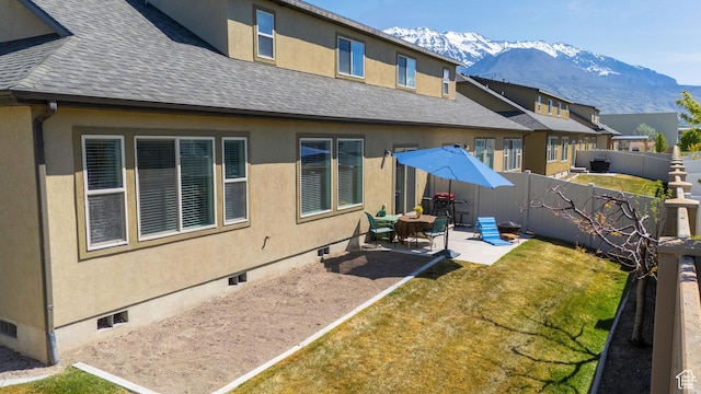 1559 W 430 N, Lindon, UT 84042 - back of house featuring a mountain view, a patio area, stucco siding, roof with shingles, and a fenced backyard