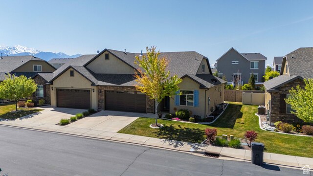 1559 W 430 N, Lindon, UT 84042 - traditional home with a front yard, stucco siding, a residential view, and driveway