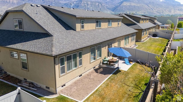 1559 W 430 N, Lindon, UT 84042 - back of house featuring a mountain view, a patio, stucco siding, crawl space, and roof with shingles