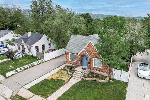 173 W 300 N, Bountiful, UT 84010 - view of front of house featuring a gate, brick siding, and asphalt driveway