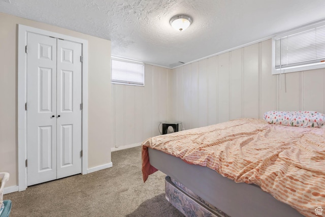 173 W 300 N, Bountiful, UT 84010 - carpeted bedroom featuring a closet, a textured ceiling, and baseboards