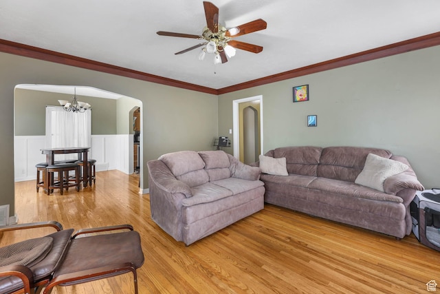 173 W 300 N, Bountiful, UT 84010 - living area with a chandelier, light wood-style floors, arched walkways, ceiling fan, and ornamental molding