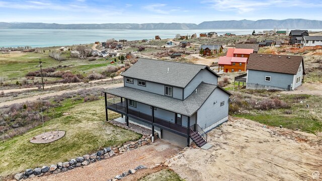 1504 N Sculpin Loop, Garden City, UT 84028 - drone / aerial view with a water and mountain view