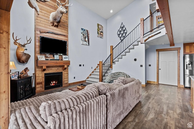 1504 N Sculpin Loop, Garden City, UT 84028 - living room featuring recessed lighting, baseboards, wood finished floors, stairway, and a fireplace
