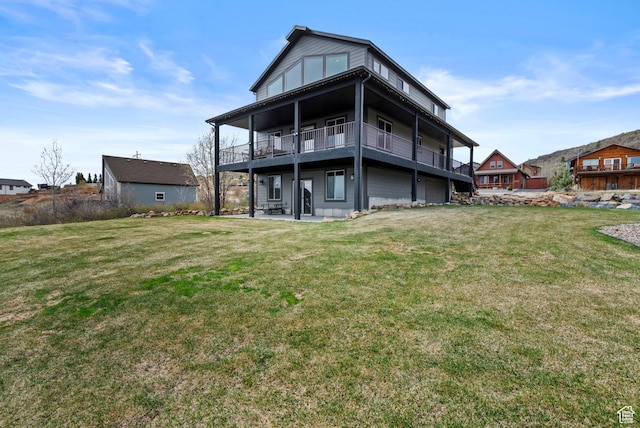 1504 N Sculpin Loop, Garden City, UT 84028 - back of property with a balcony, a yard, and a patio