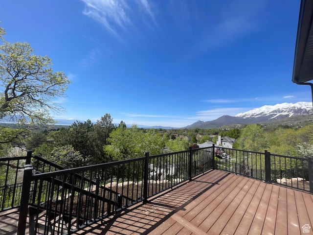 wooden deck with stairs and a mountain view