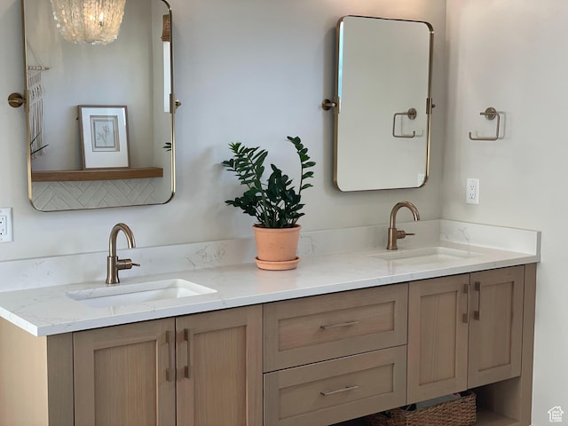 bathroom featuring double vanity and a sink