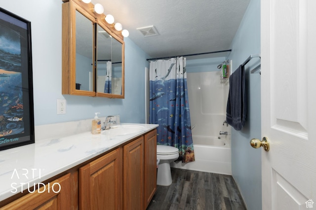 full bathroom featuring toilet, visible vents, shower / bath combination with curtain, vanity, and wood finished floors