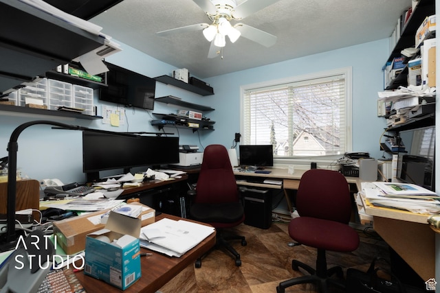 office space with a ceiling fan