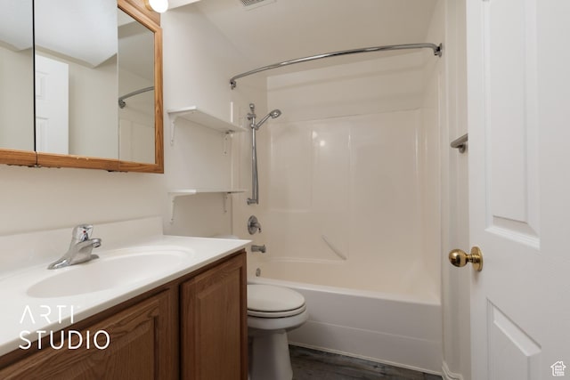 full bath featuring toilet, vanity, shower / tub combination, and wood finished floors
